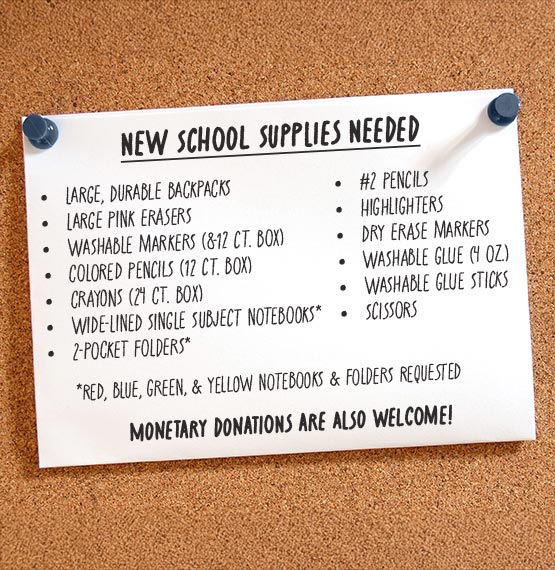 list of new school supplies needed for FABFAN on white paper pinned up by tacks on a bulletin board