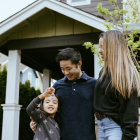 Happy family outside of home