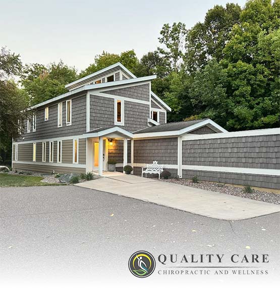 image of Quality Care Chiropractic building in Medford, WI with their logo overlayed the bottom right corner