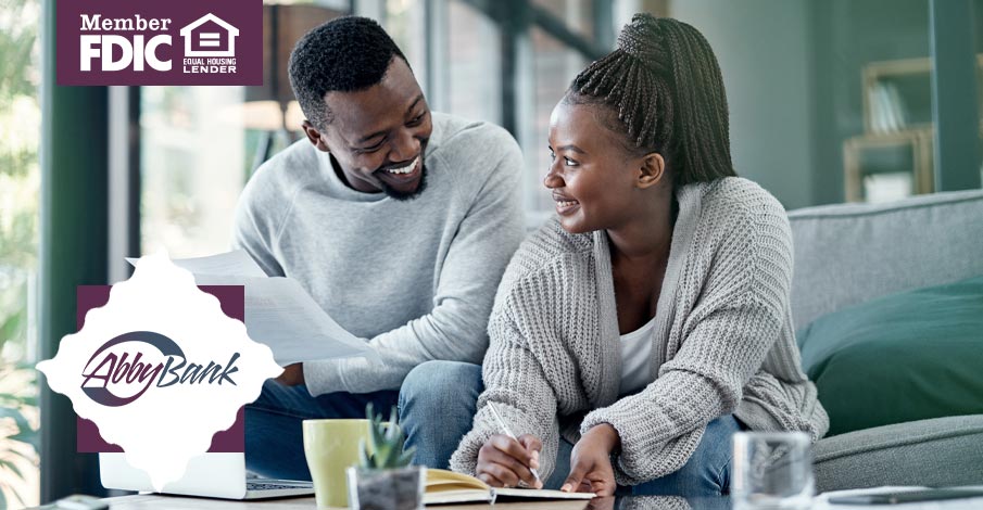 young black couple looking over paperwork together