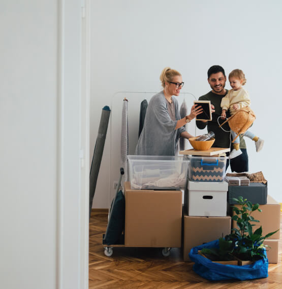 Parents and son with boxes