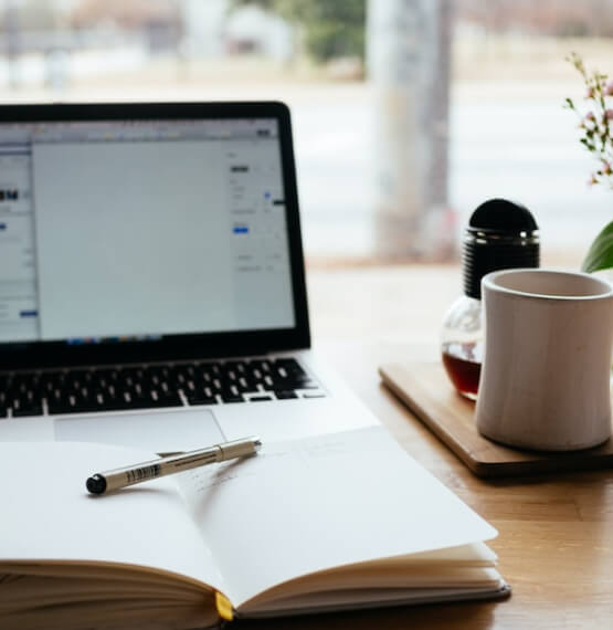 Notebook and laptop on desktop