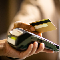 Person using credit/debit card for payment
