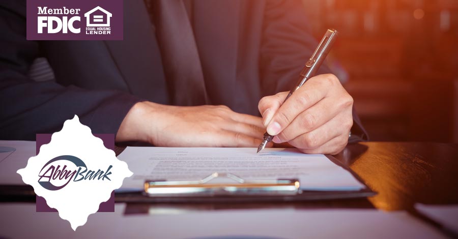 business man signing important papers with pen