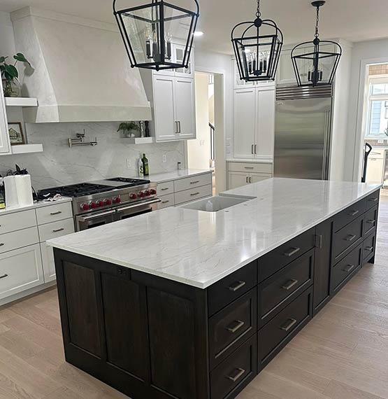 beautiful kitchen with white quartz countertops and backsplash by Stone Creations in Shawano, WI