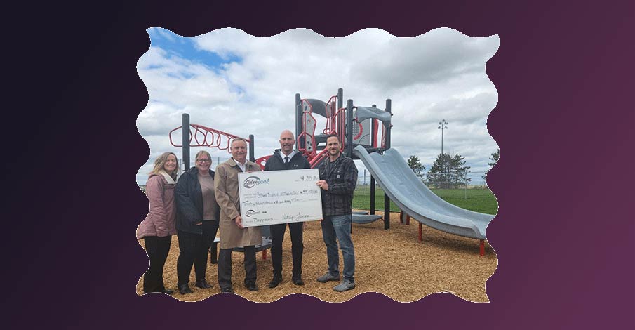 check presentation at new playground for Abbotsford School District on gradient purple background
