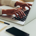 Woman typing on laptop