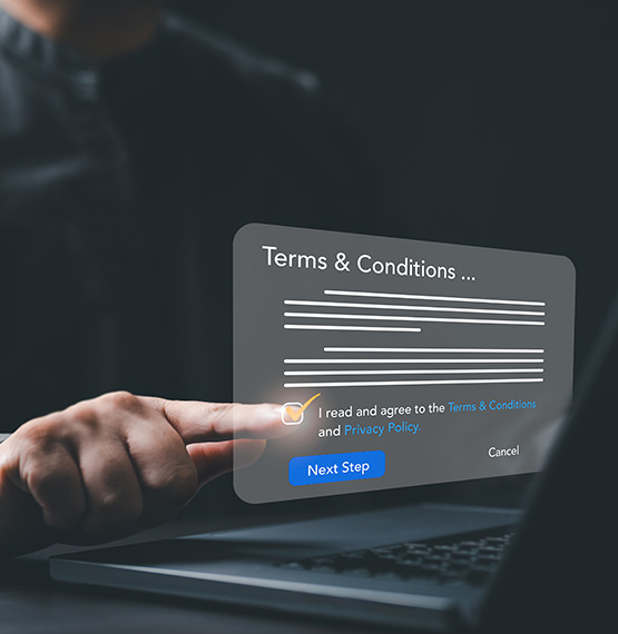 man hitting button on terms & conditions pop-up on laptop screen