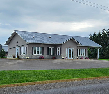 angled view of Withee branch location building from road