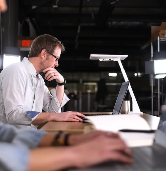 Man in office working on laptop