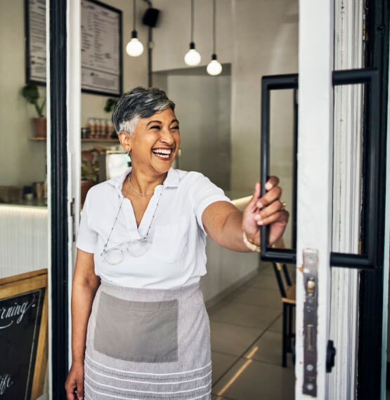 Business owner opening the storefront door