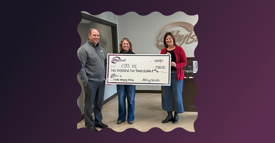 check presentation image with COTS, Inc. in Appleton on a gradient purple background